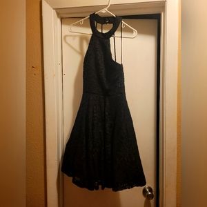 Size small black dress with glitter. Only worn once.